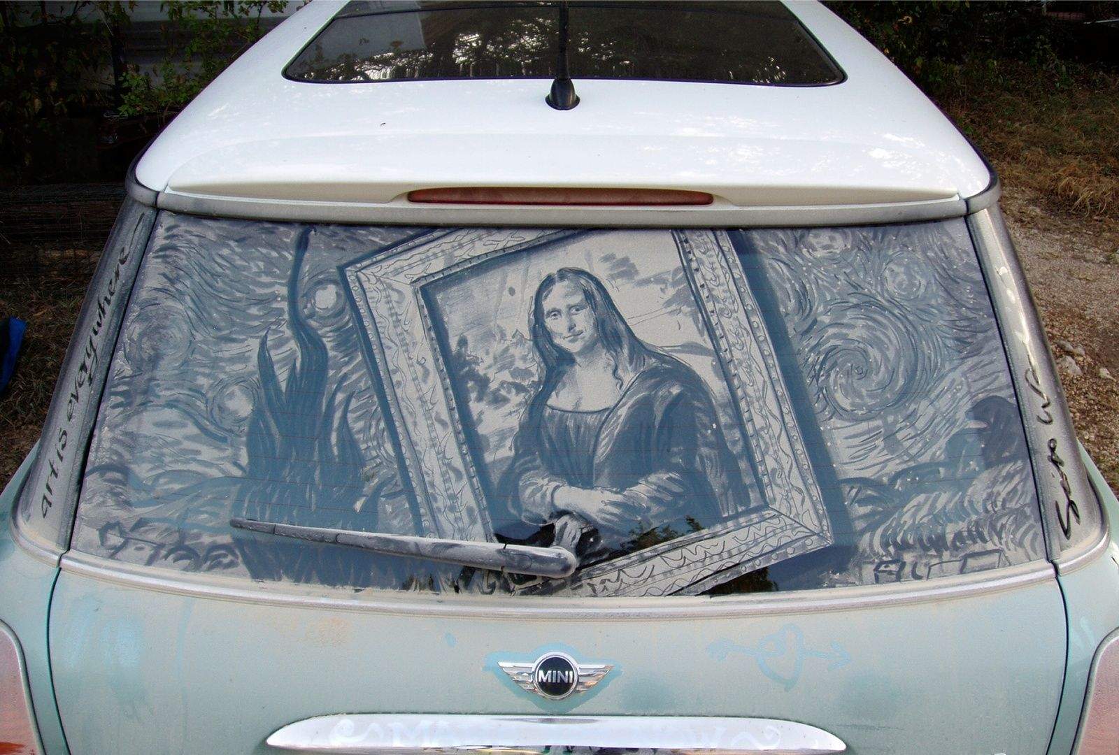 One person's dirty car window is Scott Wade's canvass. Wade found a museum mashup - Mona Lisa and Starry Night - on this dirty window. Photo courtesy of Scott Wade