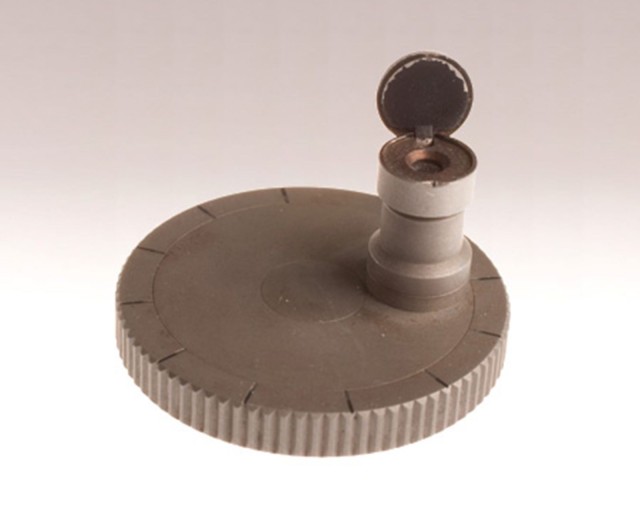 Microdot_camera001 To transfer documents during the Cold War, agents used the microdot camera to photograph and reduce pages of information onto a single tiny piece of film. The film could be embedded into the text of a letter as small as the period at the end of a sentence.