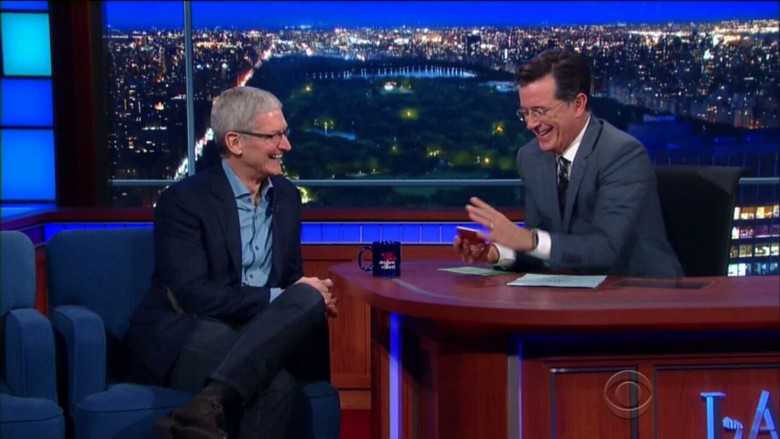Stephen Colbert, right, with iPhones 6s in hand, jokes with Apple CEO Tim Cook.