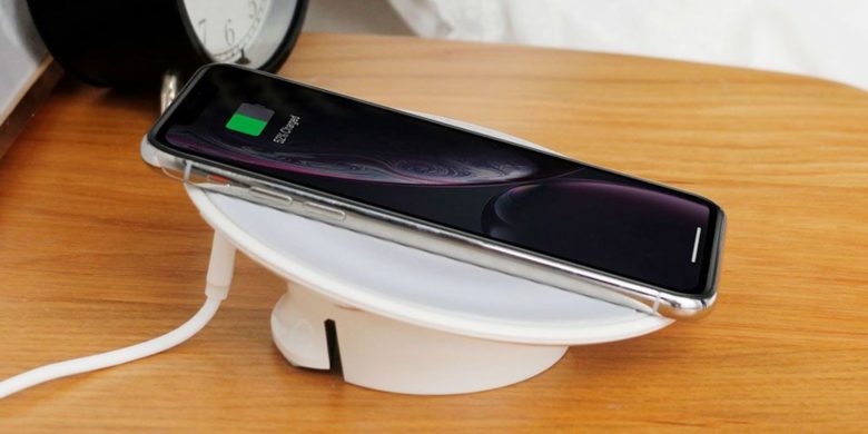This sleek wireless charging disc offers a convenient platform for using your phone while it charges.