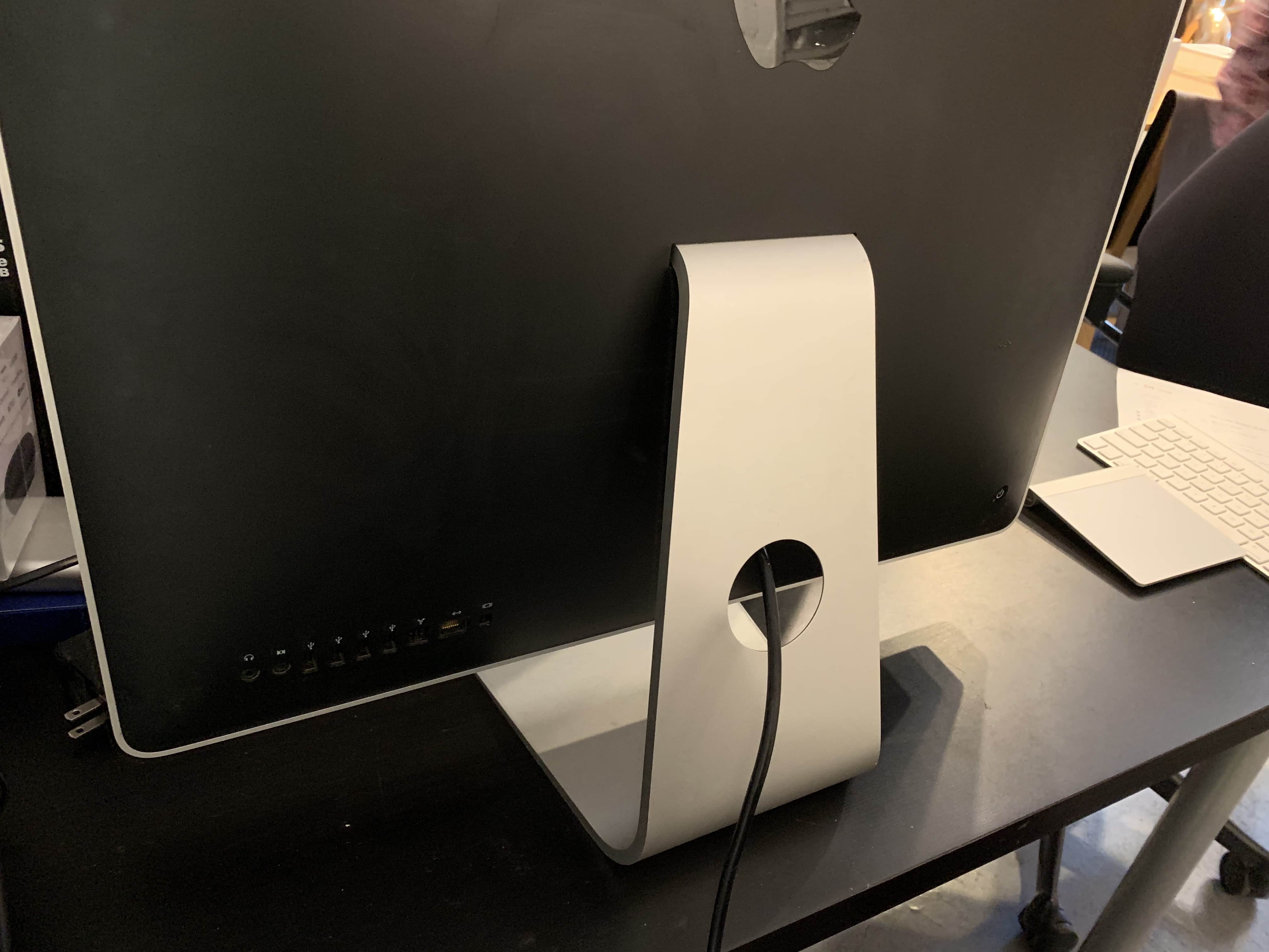 The back of an iMac, showing the cable hole in the stand