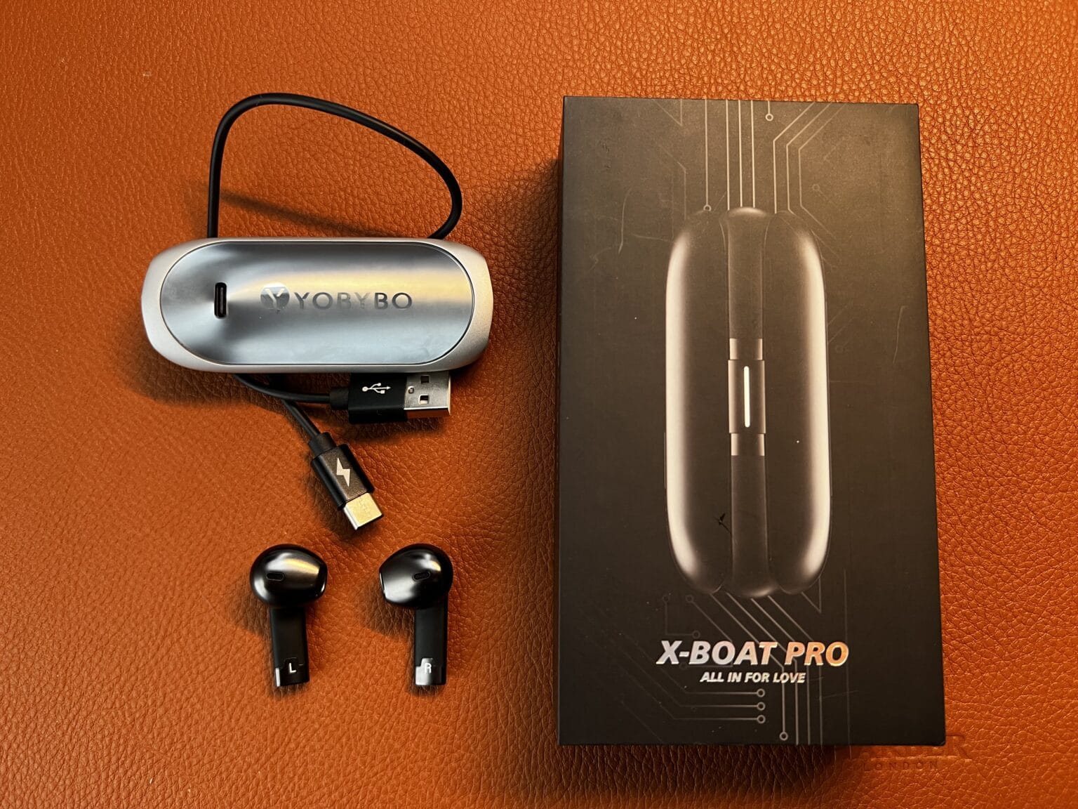The Yobybo X-Boat Pro earbuds come with a USB cable and a sleek 